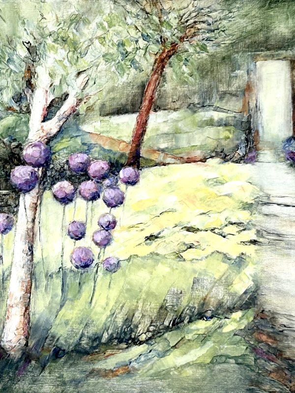 Purple Alliums and yellow daylilies beside the garden path